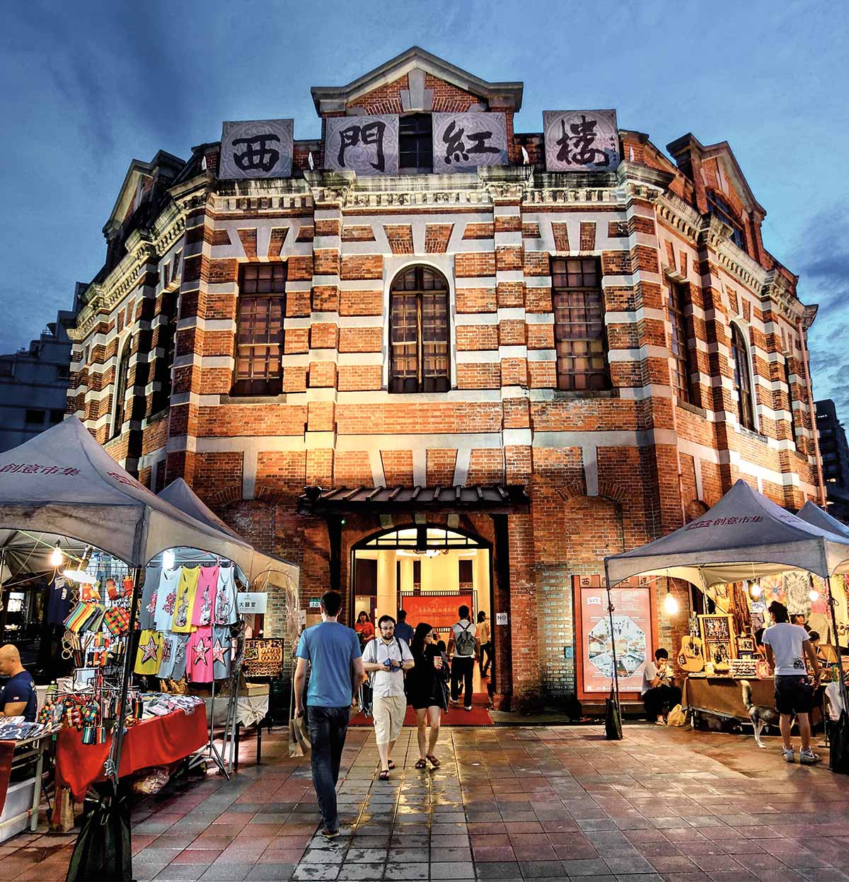 A photo of individuals walking through a market in beautiful Taiwan.